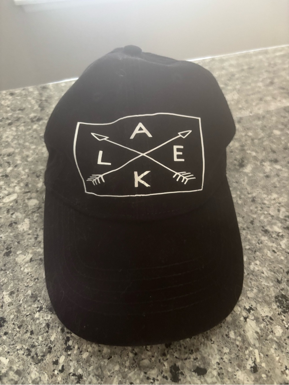 Black Lake Cap with White Arrow Emblem